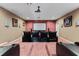 Cozy home theater room with large screen, plush seating, and custom decor at 10511 Mistflower Ln, Tampa, FL 33647