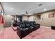 A plush home theater with reclining seating, a projector, and a convenient snack bar at 10511 Mistflower Ln, Tampa, FL 33647