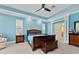 Spacious main bedroom featuring a ceiling fan and plenty of natural light at 10511 Mistflower Ln, Tampa, FL 33647