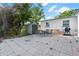 The backyard has a seating area and a grill at 1099 7Th Ne Ave, Largo, FL 33770