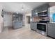 Spacious kitchen with stainless steel appliances and stylish gray cabinetry offering plenty of storage at 1099 7Th Ne Ave, Largo, FL 33770