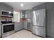 Updated kitchen featuring stainless steel appliances and abundant cabinet space for storage and convenience at 1099 7Th Ne Ave, Largo, FL 33770