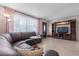 Comfortable living room featuring a sectional sofa, natural light, and a media center at 1099 7Th Ne Ave, Largo, FL 33770