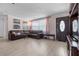 Inviting living room featuring a comfortable sofa, natural light, and a decorative entrance door at 1099 7Th Ne Ave, Largo, FL 33770