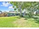 Attractive single story home with mature trees, lovely landscaping and stone-accented garage at 1220 Pinellas Point S Dr, St Petersburg, FL 33705