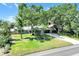 This single-story home is surrounded by beautiful landscaping with a stone-accented facade and plenty of shade trees at 1220 Pinellas Point S Dr, St Petersburg, FL 33705