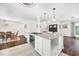 Modern kitchen with island, stainless appliances, and open floor plan at 1220 Pinellas Point S Dr, St Petersburg, FL 33705