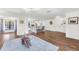 Spacious living room and kitchen combo; great entertaining space with hardwood floors and bright natural light at 1220 Pinellas Point S Dr, St Petersburg, FL 33705