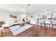 Spacious living room features hardwood floors, modern furniture and decor at 1220 Pinellas Point S Dr, St Petersburg, FL 33705
