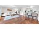Cozy Living room with white sofa, hardwood floors, and unique coffee table; bright and airy at 1220 Pinellas Point S Dr, St Petersburg, FL 33705