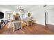 Bright and airy living room with hardwood floors, stone fireplace, and neutral decor at 1220 Pinellas Point S Dr, St Petersburg, FL 33705