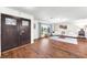 Spacious living room with hardwood floors, bright windows, and stylish decor; flooded with natural light at 1220 Pinellas Point S Dr, St Petersburg, FL 33705