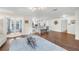 Bright, open living room with hardwood floors flows into the modern kitchen at 1220 Pinellas Point S Dr, St Petersburg, FL 33705