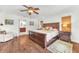 Comfortable main bedroom with wooden floors and ensuite bath at 1220 Pinellas Point S Dr, St Petersburg, FL 33705