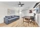 Bright home office with a ceiling fan and a comfortable pull out sofa at 1220 Pinellas Point S Dr, St Petersburg, FL 33705