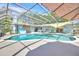 Gorgeous screened-in pool with overhead shade cover and outdoor living area at 1220 Pinellas Point S Dr, St Petersburg, FL 33705