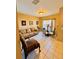Cozy dining area with a round table, tan walls, and a comfortable upholstered chair at 12367 Foxmoor Peak Dr, Riverview, FL 33579