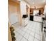 Kitchen features an island, granite countertops, tiled flooring and stainless steel appliances at 12367 Foxmoor Peak Dr, Riverview, FL 33579