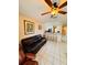 Bright living area open to the kitchen, with tile flooring, a ceiling fan and bar seating at 12367 Foxmoor Peak Dr, Riverview, FL 33579