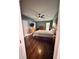Main bedroom featuring a ceiling fan, hardwood floors, and bright lighting at 12367 Foxmoor Peak Dr, Riverview, FL 33579