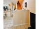 Staircase leads to a bright living area and the kitchen featuring granite countertops at 12367 Foxmoor Peak Dr, Riverview, FL 33579