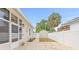 View of a backyard featuring a shed, landscaping, and a white vinyl fence at 1323 48Th N Ave, St Petersburg, FL 33703
