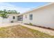 Backyard featuring a walkway, garden bed, and a view of the back of the home at 1323 48Th N Ave, St Petersburg, FL 33703