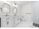 Bathroom with dual vanities, marble countertops, and a walk-in shower at 1323 48Th N Ave, St Petersburg, FL 33703