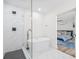 Elegant bathroom with a sleek, freestanding tub and glass-enclosed shower with black hardware at 1323 48Th N Ave, St Petersburg, FL 33703
