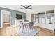 Dining room featuring a modern table, chairs, and a view of the backyard through a large window at 1323 48Th N Ave, St Petersburg, FL 33703