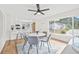 Dining room featuring a modern table, chairs, and a view of the kitchen at 1323 48Th N Ave, St Petersburg, FL 33703