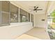 View of a covered front porch with ceiling fan, and manicured landscaping at 1323 48Th N Ave, St Petersburg, FL 33703