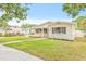 Charming home featuring a manicured lawn and beautiful landscaping at 1323 48Th N Ave, St Petersburg, FL 33703