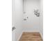 The laundry room has washer hookups, wood look floor, and white walls at 1323 48Th N Ave, St Petersburg, FL 33703