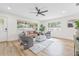 Inviting living room with natural light, comfortable seating, and hardwood floors at 1323 48Th N Ave, St Petersburg, FL 33703
