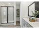Bathroom with a glass shower and vanity with framed mirror at 1497 Laredo Ave, Spring Hill, FL 34608