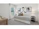 Bright bedroom with a twin bed, hockey decor, and natural light, perfect for a young sports enthusiast at 1497 Laredo Ave, Spring Hill, FL 34608