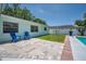 Backyard patio with a view of the in ground pool at 14984 Cromwell Dr, Clearwater, FL 33764