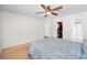 Spacious bedroom with a walk-in closet, ceiling fan, neutral carpet and light-filled ambiance at 14984 Cromwell Dr, Clearwater, FL 33764