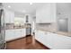 Renovated kitchen offers white cabinets, granite countertops, and stainless appliances at 14984 Cromwell Dr, Clearwater, FL 33764