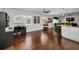 Open concept living space with hardwood floors, connecting seamlessly to the kitchen and dining area at 14984 Cromwell Dr, Clearwater, FL 33764