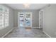 Bedroom featuring a back patio view and tile flooring at 1702 E Knollwood St, Tampa, FL 33610