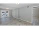 Bedroom featuring a back patio view, tile flooring and ceiling fan at 1702 E Knollwood St, Tampa, FL 33610