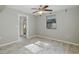 Bedroom featuring tile flooring and a window at 1702 E Knollwood St, Tampa, FL 33610
