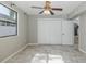 Bedroom featuring a ceiling fan, and plenty of storage at 1702 E Knollwood St, Tampa, FL 33610