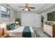 Staged bedroom featuring a ceiling fan, and plenty of storage at 1702 E Knollwood St, Tampa, FL 33610