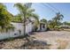 Charming single-story home showcasing a well-maintained yard with tropical landscaping at 1702 E Knollwood St, Tampa, FL 33610