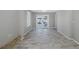 Bright living room with stone fireplace and view to back patio at 1702 E Knollwood St, Tampa, FL 33610