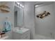 Modern bathroom with white vanity, decorative mirror, and clean, updated fixtures and decor at 222 Draw Bridge Ln, Valrico, FL 33594