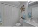 Updated bathroom featuring a vanity, storage closet and neutral design elements at 222 Draw Bridge Ln, Valrico, FL 33594